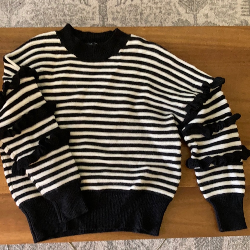 Black and white striped sweater with ruffles